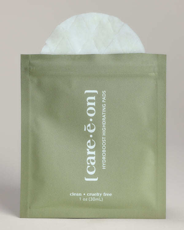 Care.ē.on Hydroboost Highdrating Pad in its green single-use pouch.