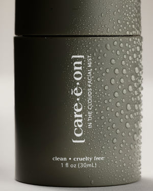 Care.ē.on In the Clouds Mist with water droplets on the bottle.