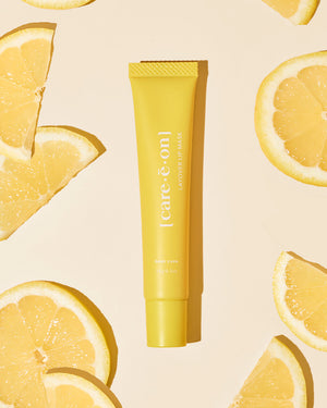 Care.ē.on Layover Lip Mask surrounded by sliced citrus.