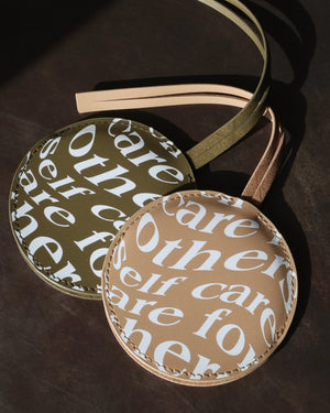 Green and tan Care.ē.on Vegan Voyage Luggage Tags with printed Care for Others, Self Care design.