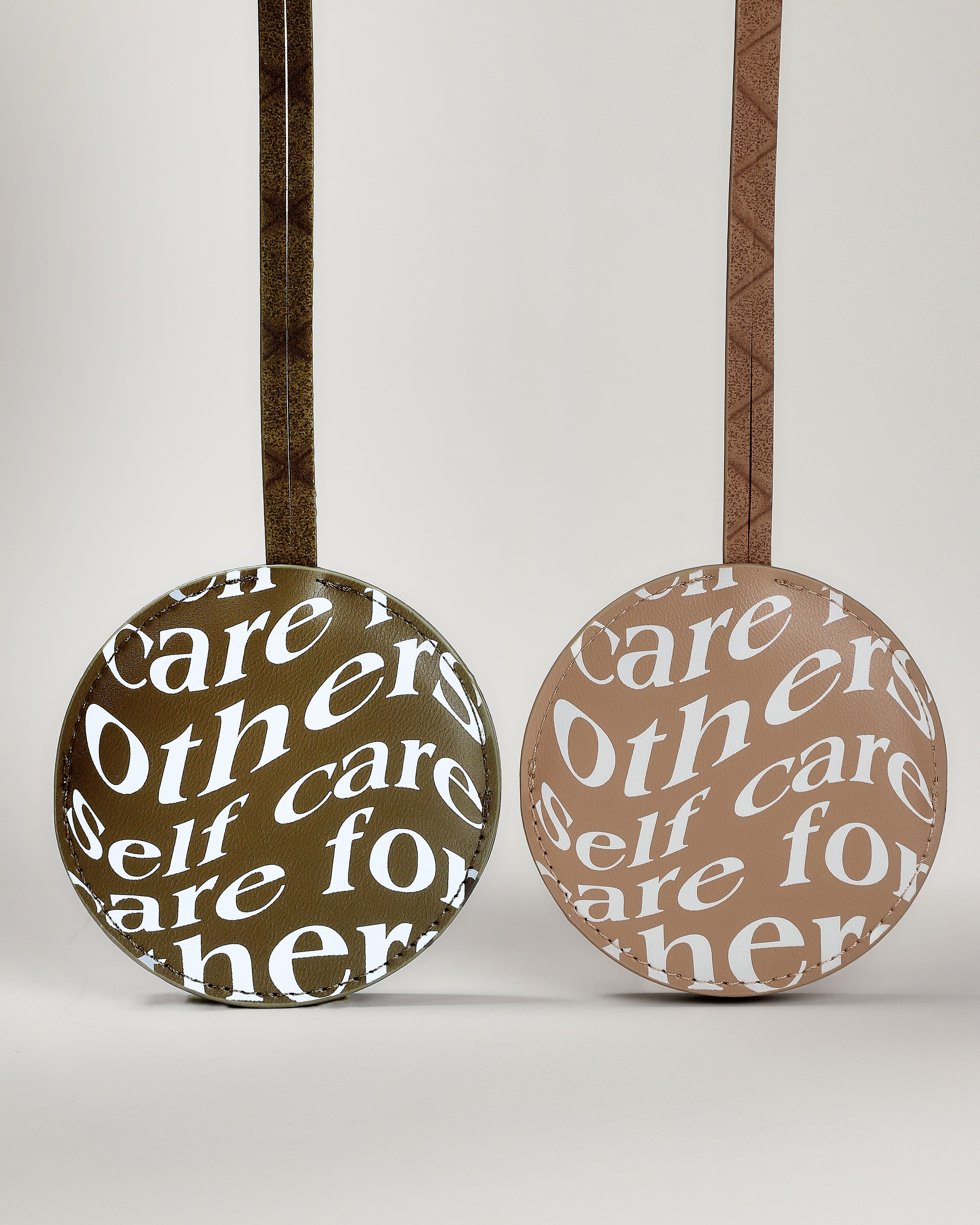 Care.ē.on Vegan Voyage Luggage Tags in green and tan.
\